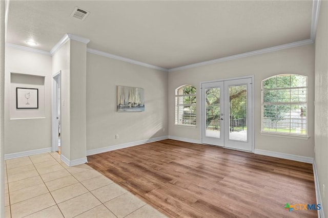 402 Prospector Trl, Harker Heights, TX 76548 - spare room with french doors, crown molding, and light wood finished floors