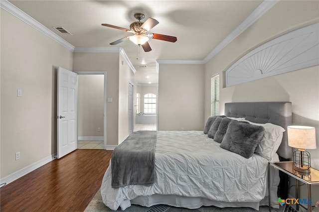 402 Prospector Trl, Harker Heights, TX 76548 - bedroom featuring wood finished floors, ornamental molding, ensuite bath, and ceiling fan