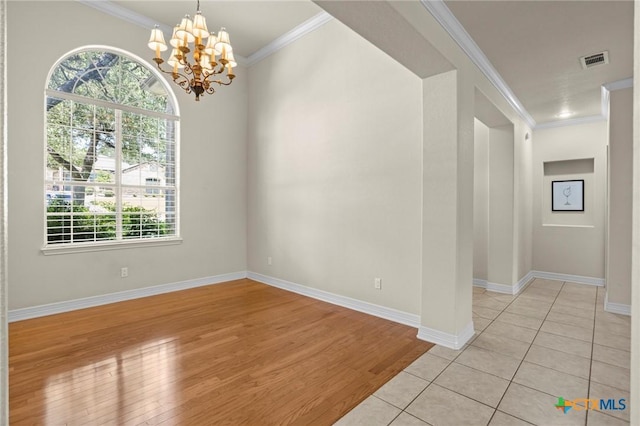 402 Prospector Trl, Harker Heights, TX 76548 - empty room featuring plenty of natural light, crown molding, a chandelier, and light wood-type flooring