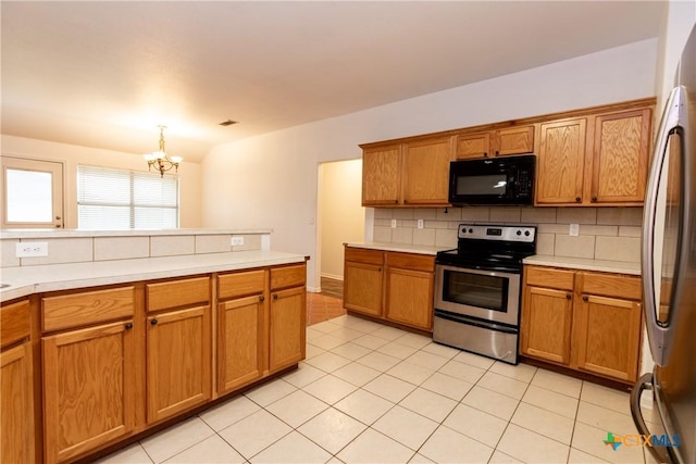 212 Oak Ridge Dr, Nolanville, TX 76559 - kitchen featuring decorative backsplash, brown cabinets, appliances with stainless steel finishes, and light countertops