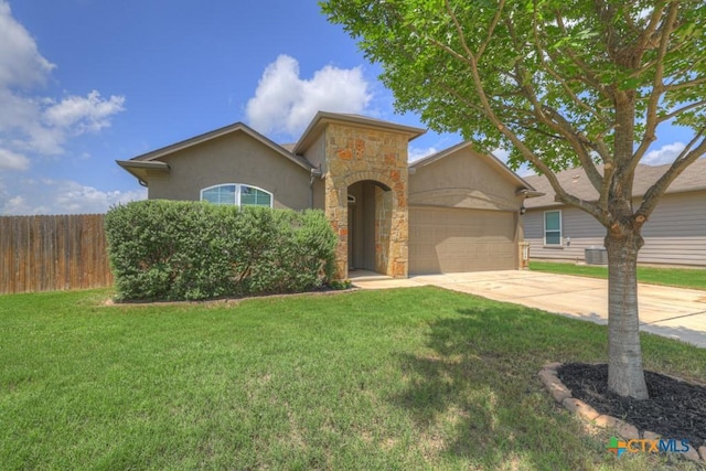 1398 Fall Cover St, New Braunfels, TX 78130 - mediterranean / spanish house featuring an attached garage, driveway, stucco siding, and stone siding