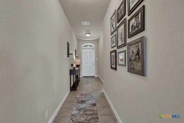 1398 Fall Cover St, New Braunfels, TX 78130 - hall featuring light tile patterned floors and baseboards