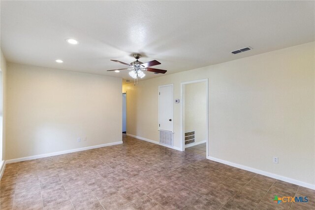 unfurnished room with ceiling fan