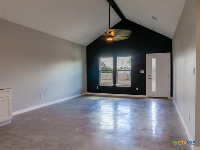 interior space featuring beam ceiling, high vaulted ceiling, concrete floors, and ceiling fan