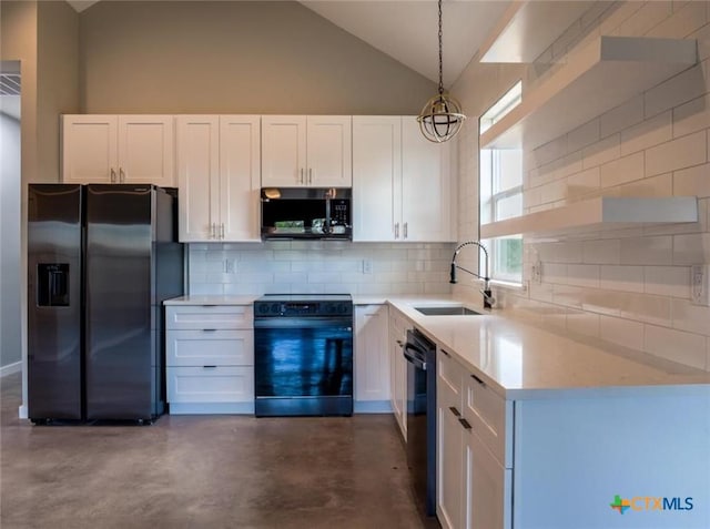 kitchen with white cabinetry, sink, hanging light fixtures, and black appliances