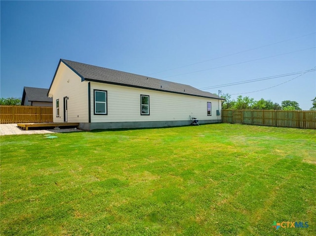 307 Cedarhill Dr, Granite Shoals, TX 78654 - rear view of property featuring fence and a lawn