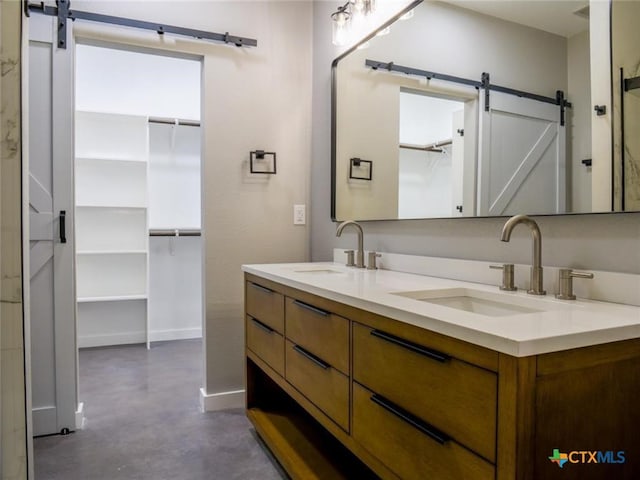 bathroom with vanity and concrete floors