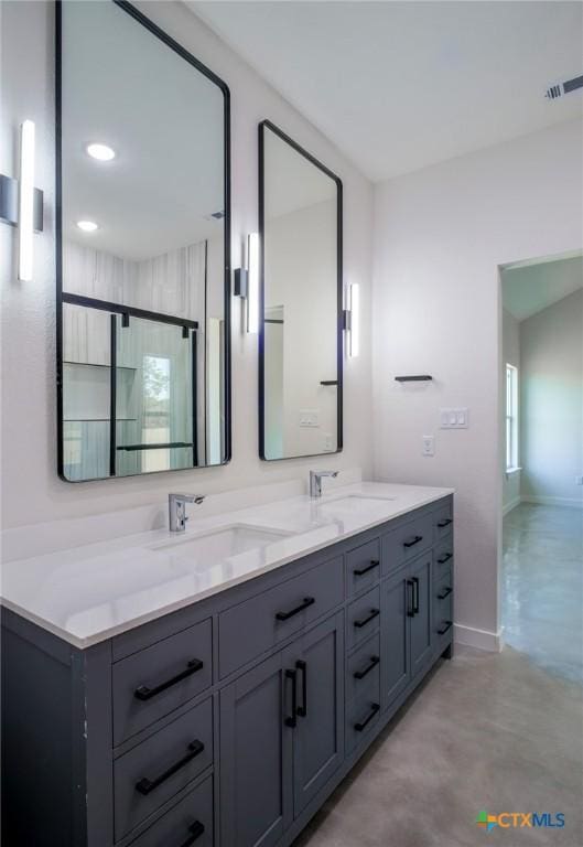 307 Cedarhill Dr, Granite Shoals, TX 78654 - full bath with baseboards, double vanity, a sink, and visible vents