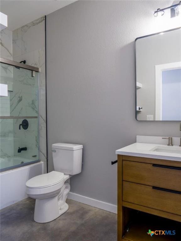 full bathroom with vanity, toilet, concrete flooring, and combined bath / shower with glass door