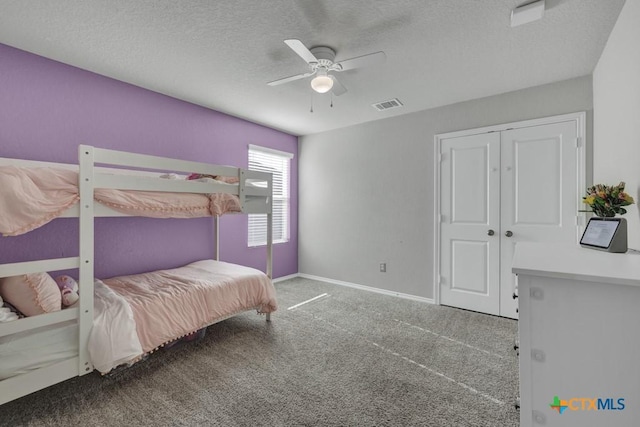 2328 Arctic Warbler, New Braunfels, TX 78130 - bedroom featuring carpet, a textured ceiling, a ceiling fan, baseboards, and a closet