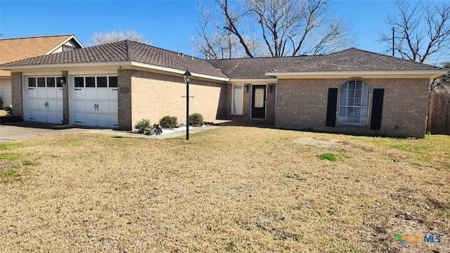 single story home featuring a garage and a front yard