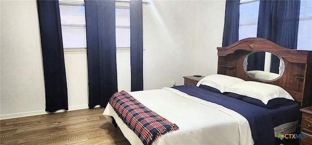 bedroom featuring dark hardwood / wood-style flooring