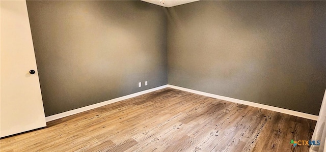 empty room with light hardwood / wood-style floors