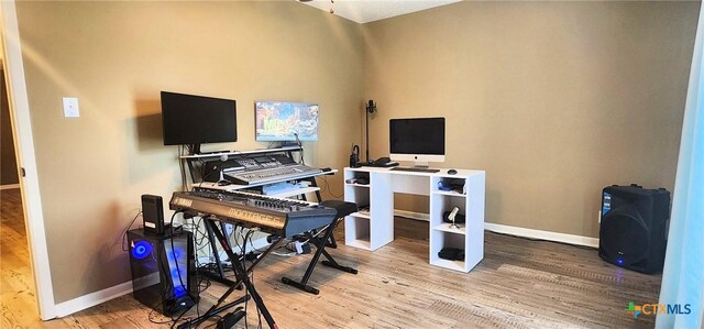 home office with wood-type flooring