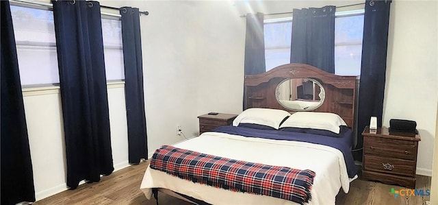 bedroom featuring wood-type flooring