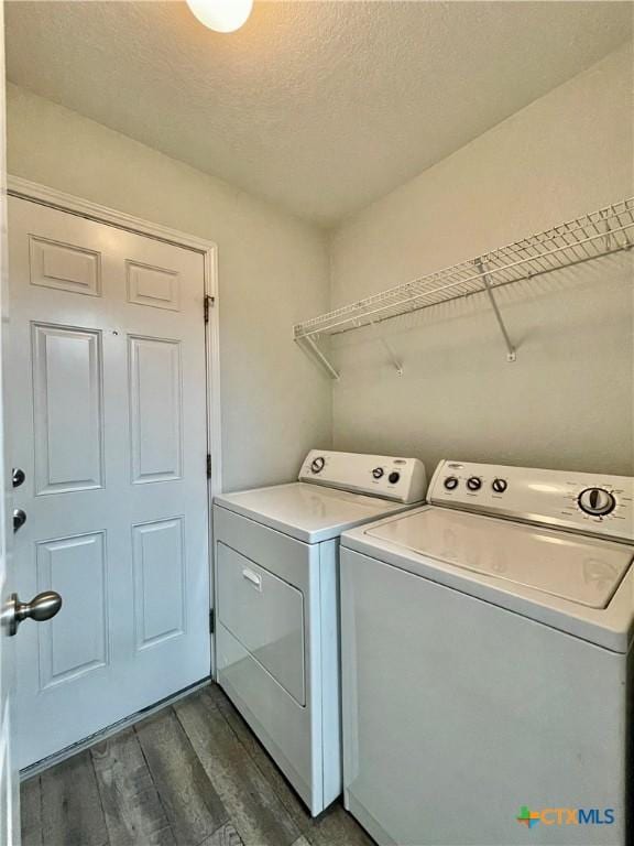 110 Rush Hvn, San Marcos, TX 78666 - laundry room with laundry area, dark wood finished floors, separate washer and dryer, and a textured ceiling