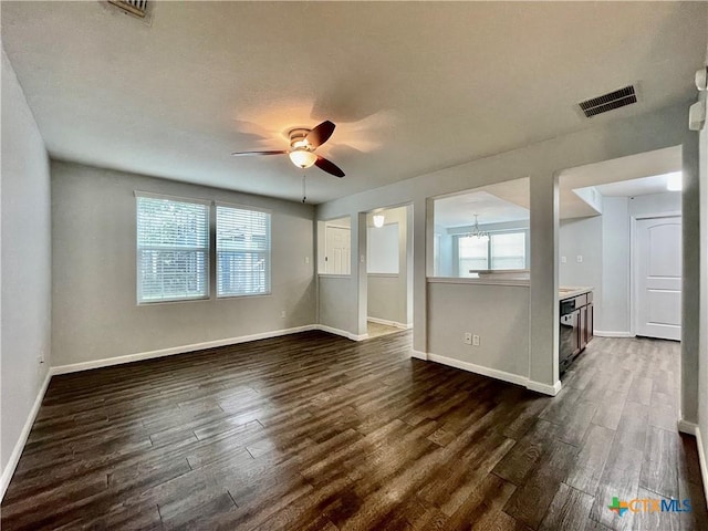 110 Rush Hvn, San Marcos, TX 78666 - unfurnished room with ceiling fan, a wealth of natural light, visible vents, and dark wood finished floors