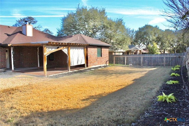 exterior space with a yard and a patio