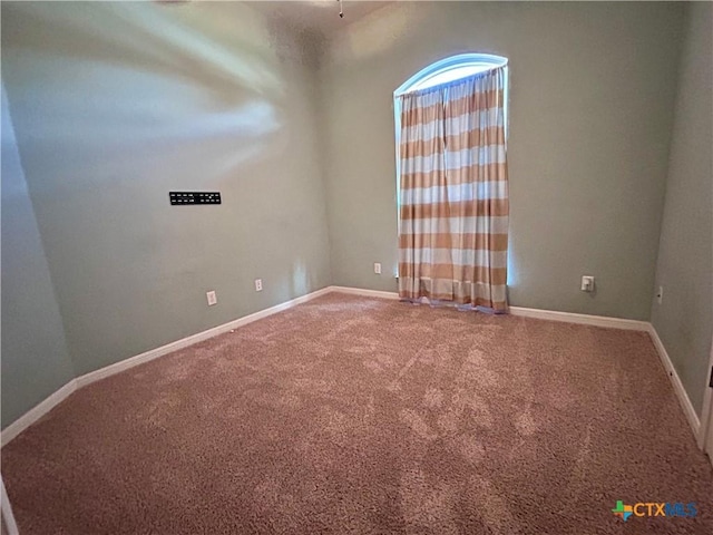 empty room with carpet flooring