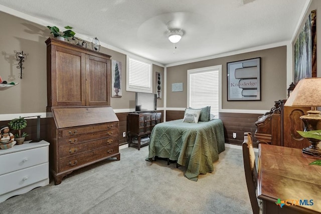 332 W Klein St, Seguin, TX 78155 - bedroom with light carpet, a ceiling fan, and crown molding