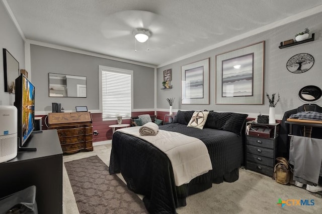 332 W Klein St, Seguin, TX 78155 - bedroom with carpet floors, ornamental molding, a textured ceiling, and ceiling fan