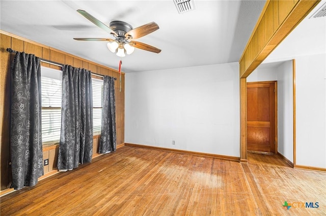 spare room featuring ceiling fan and light wood-type flooring