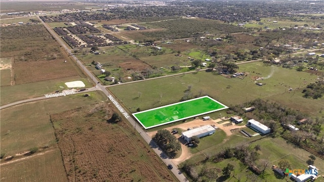 birds eye view of property featuring a rural view