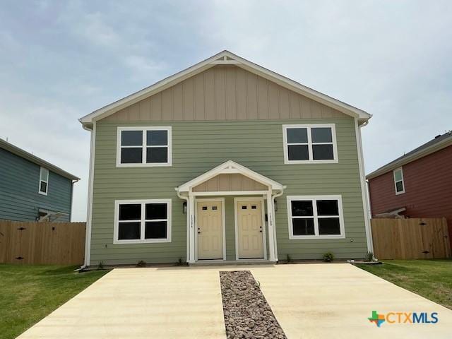 1009 S 26th St, Temple, TX 76501 - view of front of property featuring board and batten siding and a patio area