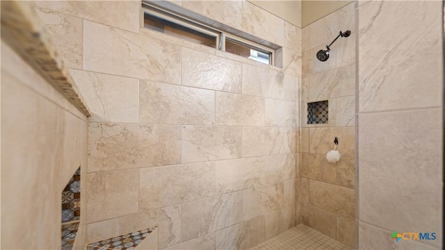 bathroom with tiled shower