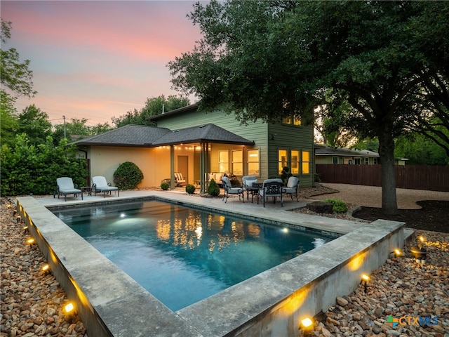 1200 Marcy St, Austin, TX 78745 - pool at dusk featuring a patio