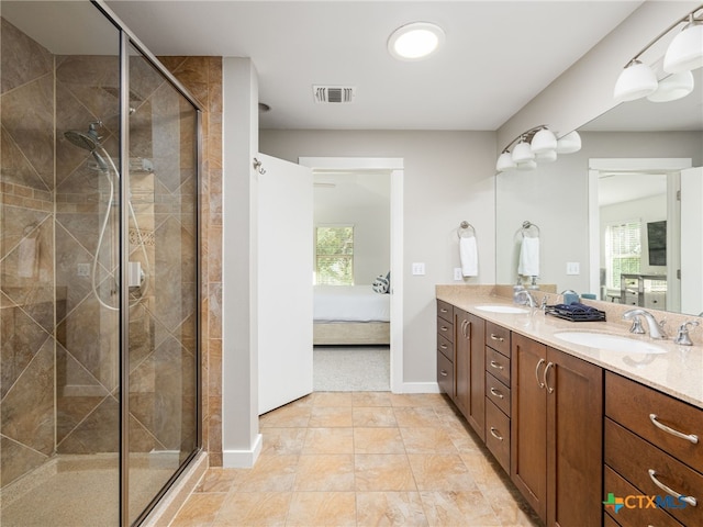 1200 Marcy St, Austin, TX 78745 - ensuite bathroom with double vanity, a shower stall, and baseboards