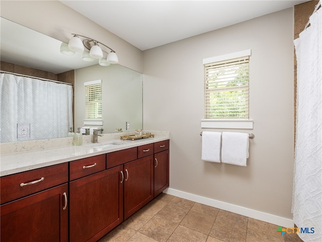 1200 Marcy St, Austin, TX 78745 - bathroom with baseboards and vanity