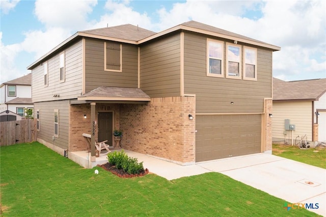 view of front of home featuring a garage and a front lawn