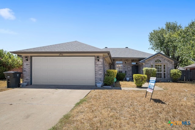 ranch-style home with a garage