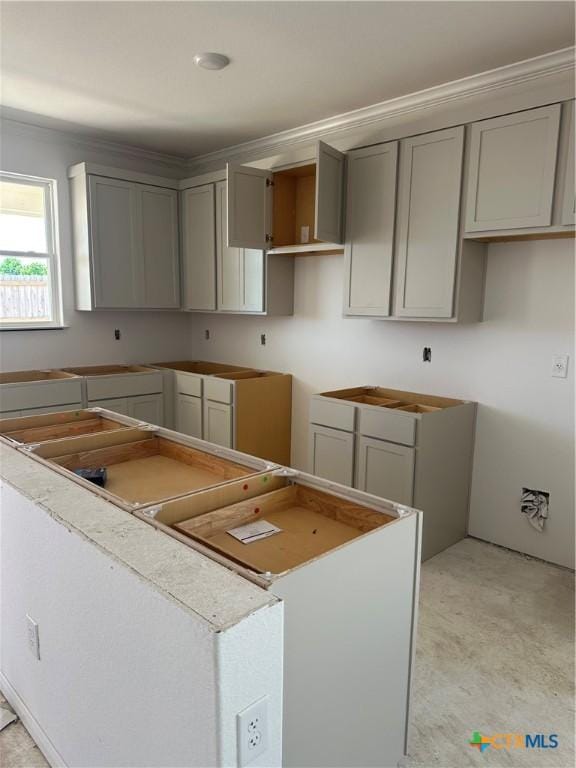 kitchen with a kitchen island and gray cabinets