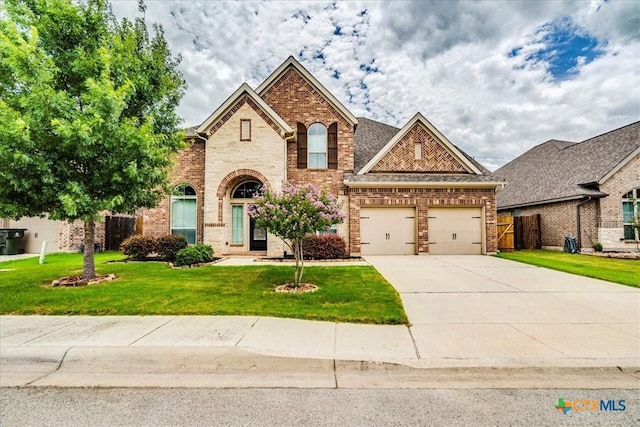 2933 Countryside Path, Seguin, TX 78155 - view of front of property with driveway, brick siding, and an attached garage