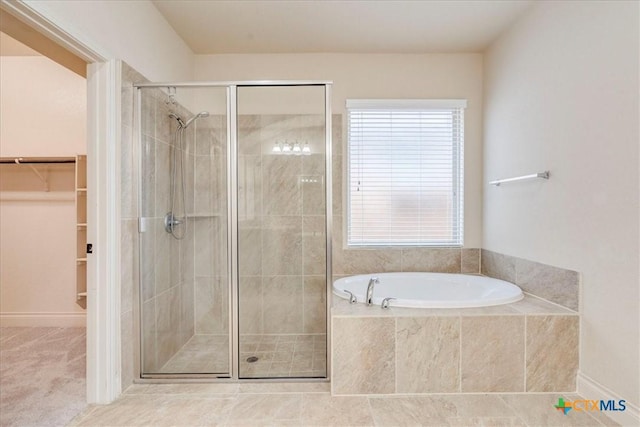 2933 Countryside Path, Seguin, TX 78155 - bathroom featuring a bath, a stall shower, and a walk in closet