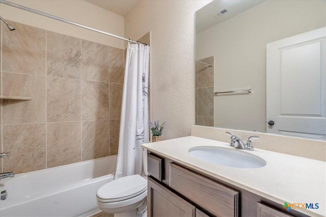 2933 Countryside Path, Seguin, TX 78155 - bathroom with shower / bath combo with shower curtain, vanity, and a textured wall