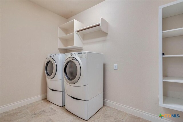 2933 Countryside Path, Seguin, TX 78155 - laundry room with independent washer and dryer and baseboards