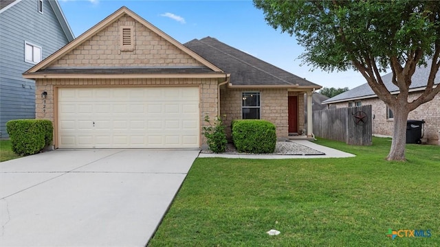 view of front of property featuring a front yard, fence, concrete driveway, an attached garage, and stone siding