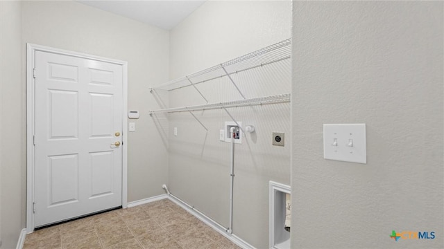 clothes washing area featuring laundry area, washer hookup, gas dryer hookup, baseboards, and electric dryer hookup