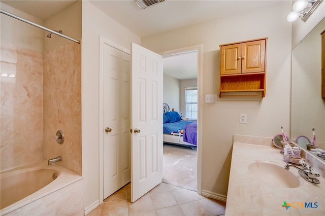 1495 Makinson Rd, La Grange, TX 78963 - ensuite bathroom featuring vanity, shower / bathtub combination, and tile patterned flooring
