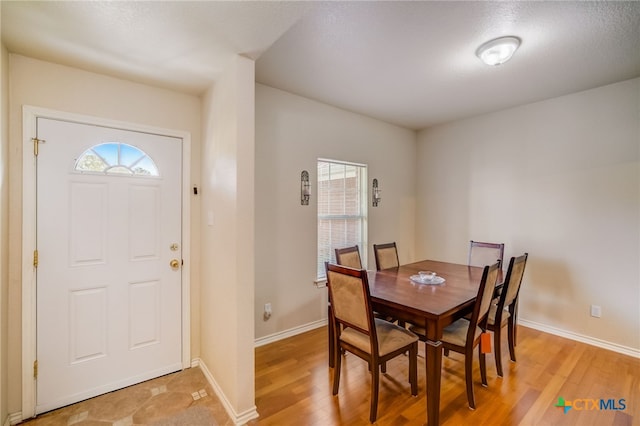 1495 Makinson Rd, La Grange, TX 78963 - dining room featuring light wood-style flooring and baseboards