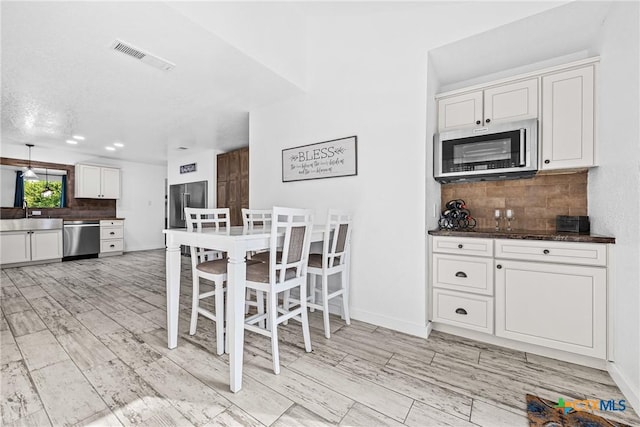 1213 Indian Trl, Salado, TX 76571 - dining room featuring light wood finished floors