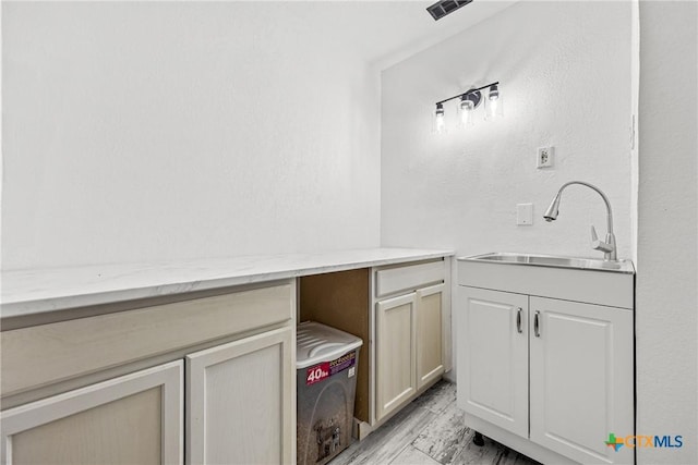1213 Indian Trl, Salado, TX 76571 - bathroom with wood finished floors and vanity