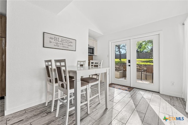 1213 Indian Trl, Salado, TX 76571 - dining space with vaulted ceiling and french doors