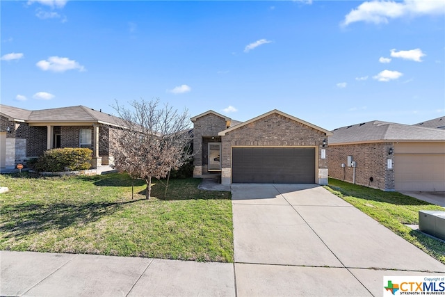 view of front of property featuring a front yard and a garage