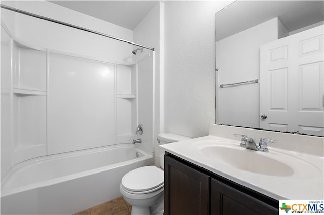 full bathroom featuring toilet, tile patterned floors, vanity, and bathing tub / shower combination