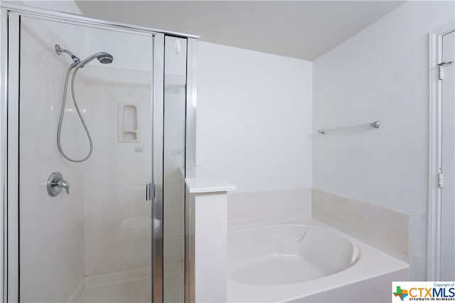 bathroom featuring plus walk in shower