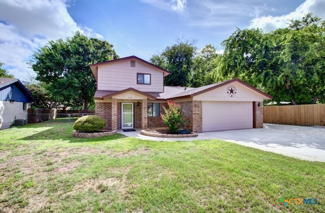 view of front of home featuring central AC unit, a garage, and a front lawn